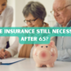 elderly couple signing life insurance papers